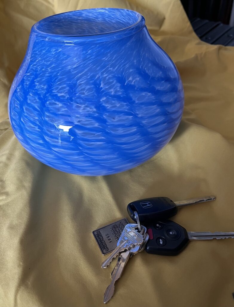a large blue glass bowl (keys for scale)